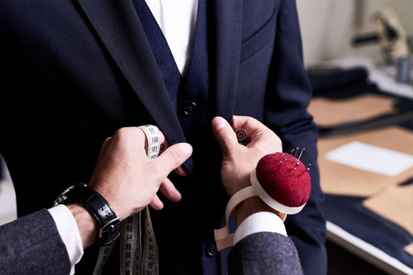 Being measured for a custom suit at MK Clothing in Burlington, Vermont